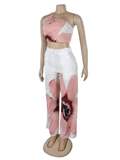 Hoochie Couture Floral Two-Piece Set – chic women’s co-ord with vibrant floral print, featuring a cropped top and matching high-waisted shorts or skirt, perfect for summer, brunch, or vacation wear