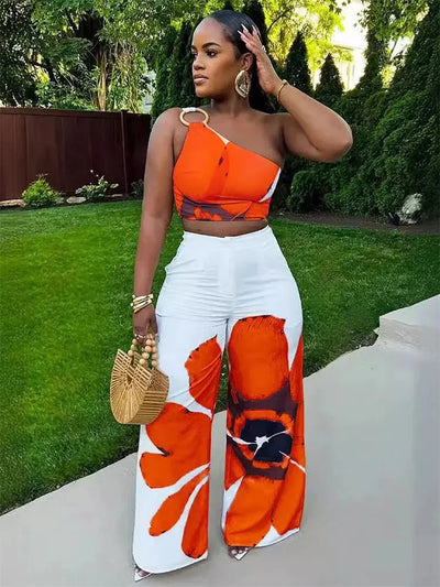 Hoochie Couture Floral Two-Piece Set – chic women’s co-ord with vibrant floral print, featuring a cropped top and matching high-waisted shorts or skirt, perfect for summer, brunch, or vacation wear