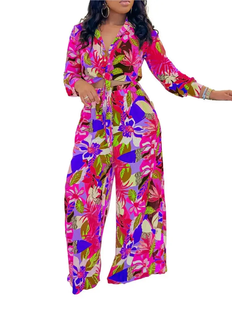 Hoochie Couture Printed Two-Piece Set – stylish women’s matching outfit with bold all-over print, featuring a crop top and high-waisted shorts or pants, perfect for summer streetwear, vacation, or festival fashion.