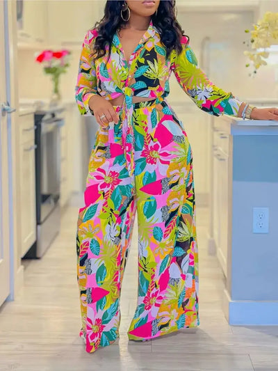 Hoochie Couture Printed Two-Piece Set – stylish women’s matching outfit with bold all-over print, featuring a crop top and high-waisted shorts or pants, perfect for summer streetwear, vacation, or festival fashion.