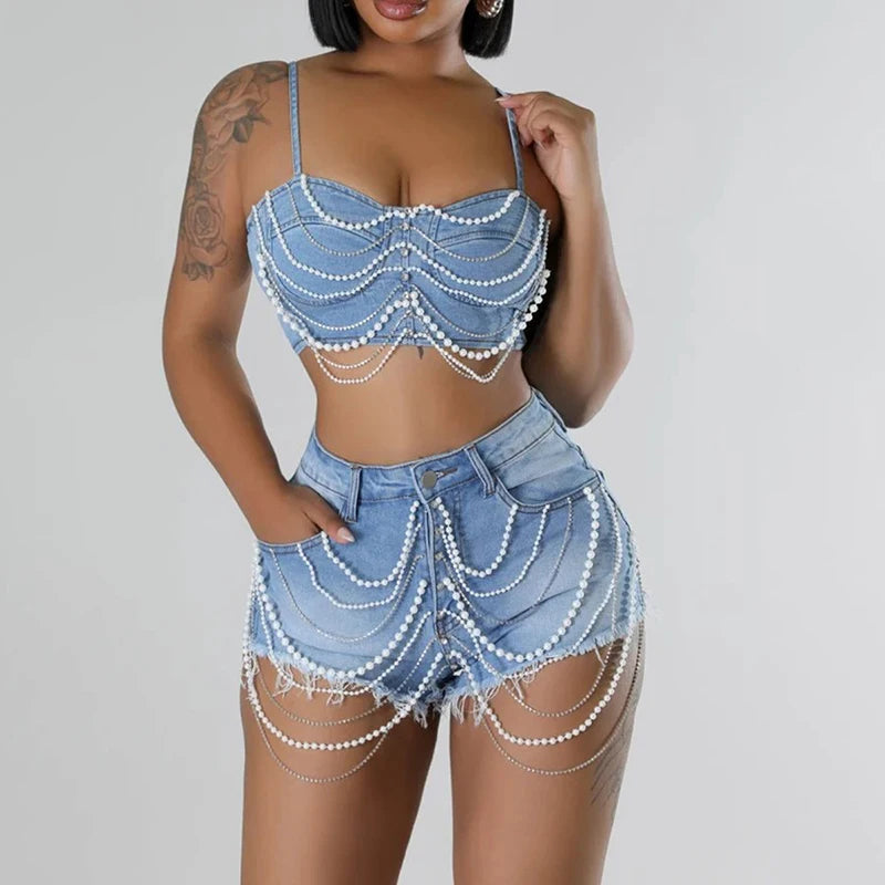 Hoochie Couture Denim Pearl Chain 2-Piece Set – women’s matching outfit with cropped jean top and pearl-detailed cargo shorts or pants, trendy Y2K streetwear look for summer or festival fashion.
