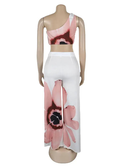 Hoochie Couture Floral Two-Piece Set – chic women’s co-ord with vibrant floral print, featuring a cropped top and matching high-waisted shorts or skirt, perfect for summer, brunch, or vacation wear
