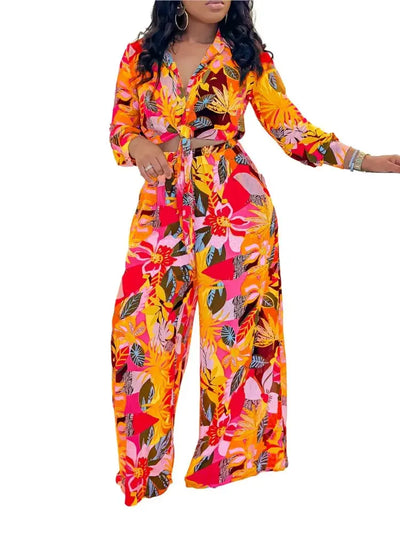 Hoochie Couture Printed Two-Piece Set – stylish women’s matching outfit with bold all-over print, featuring a crop top and high-waisted shorts or pants, perfect for summer streetwear, vacation, or festival fashion.