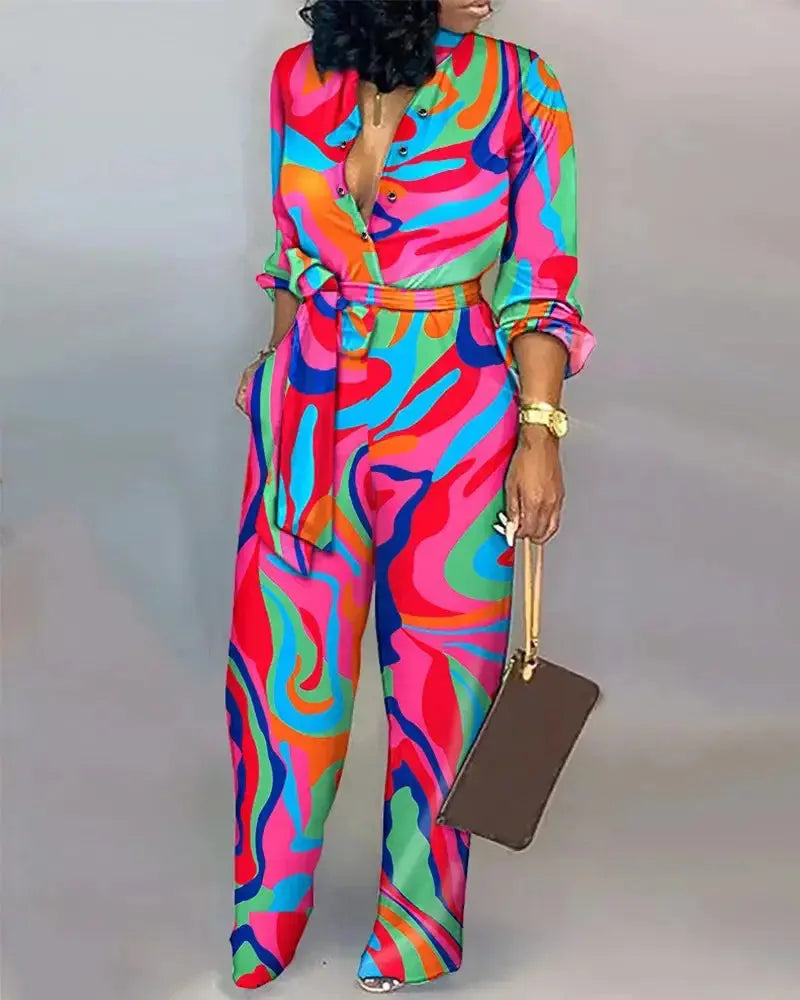 Women's stylish printed belted jumpsuit with V-neck, long sleeves, and button-up front – Hoochie Couture one-piece outfit