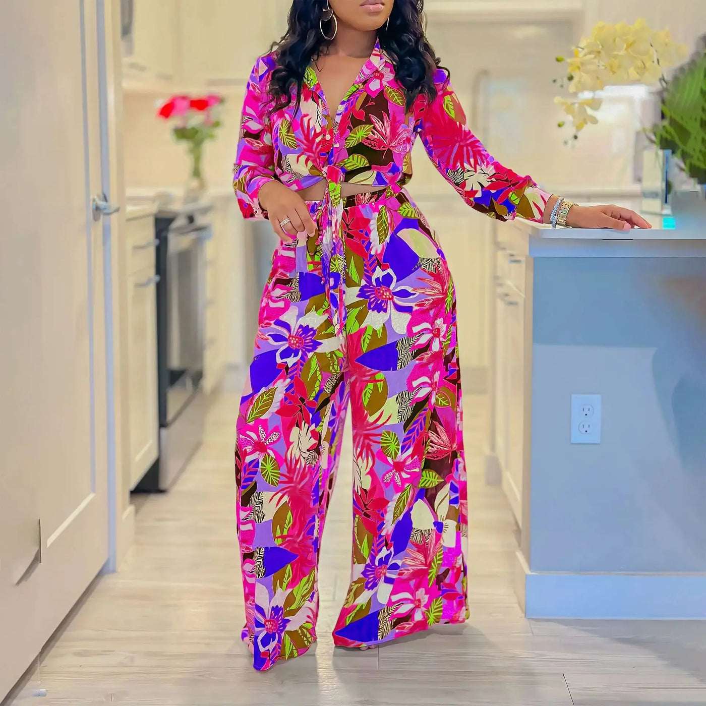 Hoochie Couture Printed Two-Piece Set – stylish women’s matching outfit with bold all-over print, featuring a crop top and high-waisted shorts or pants, perfect for summer streetwear, vacation, or festival fashion.
