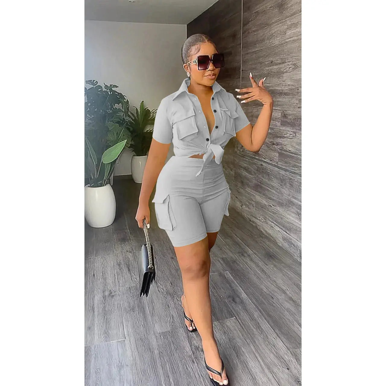 Hoochie Couture Streetwear Two-Piece Set – bold women’s matching outfit featuring an oversized graphic top and coordinating shorts or pants, perfect for edgy street style, casual wear, or festival fashion