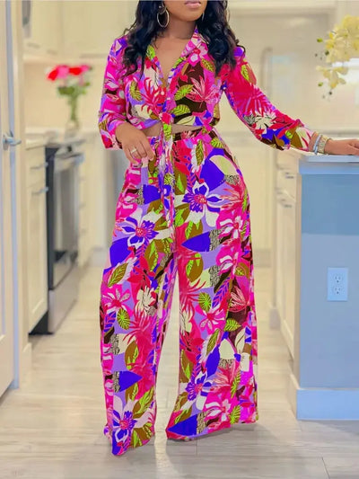 Hoochie Couture Printed Two-Piece Set – stylish women’s matching outfit with bold all-over print, featuring a crop top and high-waisted shorts or pants, perfect for summer streetwear, vacation, or festival fashion.