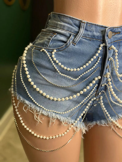 Hoochie Couture Denim Pearl Chain 2-Piece Set – women’s matching outfit with cropped jean top and pearl-detailed cargo shorts or pants, trendy Y2K streetwear look for summer or festival fashion.