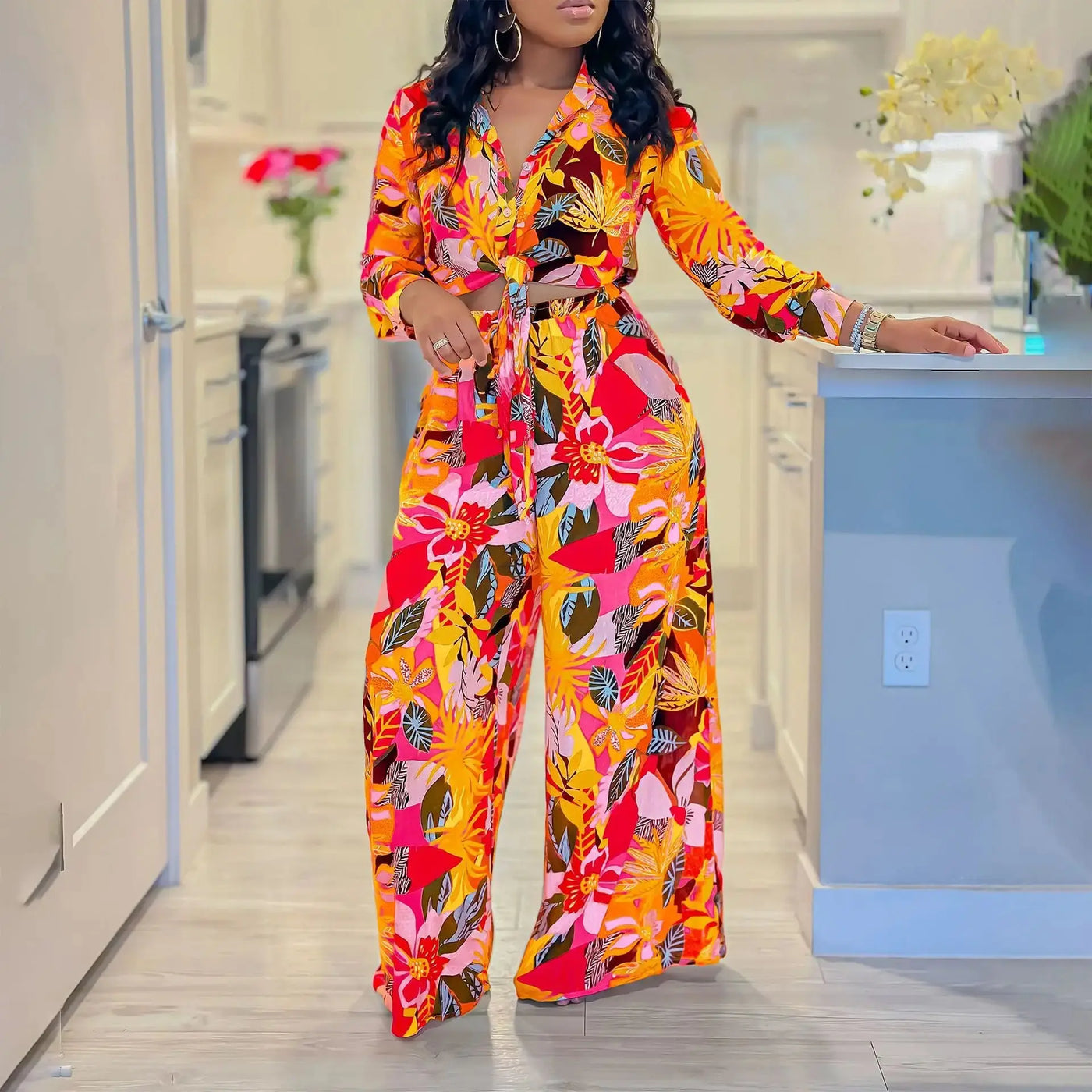 Hoochie Couture Printed Two-Piece Set – stylish women’s matching outfit with bold all-over print, featuring a crop top and high-waisted shorts or pants, perfect for summer streetwear, vacation, or festival fashion.