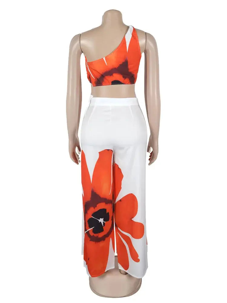 Hoochie Couture Floral Two-Piece Set – chic women’s co-ord with vibrant floral print, featuring a cropped top and matching high-waisted shorts or skirt, perfect for summer, brunch, or vacation wear