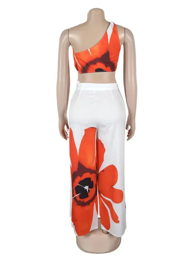 Hoochie Couture Floral Two-Piece Set – chic women’s co-ord with vibrant floral print, featuring a cropped top and matching high-waisted shorts or skirt, perfect for summer, brunch, or vacation wear