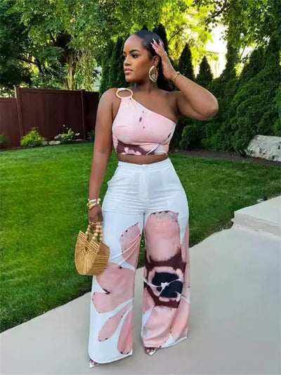 Hoochie Couture Floral Two-Piece Set – chic women’s co-ord with vibrant floral print, featuring a cropped top and matching high-waisted shorts or skirt, perfect for summer, brunch, or vacation wear
