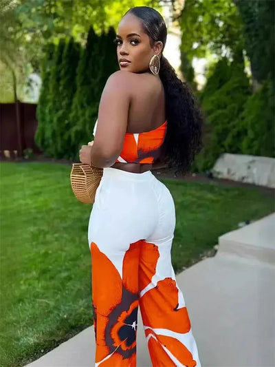 Hoochie Couture Floral Two-Piece Set – chic women’s co-ord with vibrant floral print, featuring a cropped top and matching high-waisted shorts or skirt, perfect for summer, brunch, or vacation wear