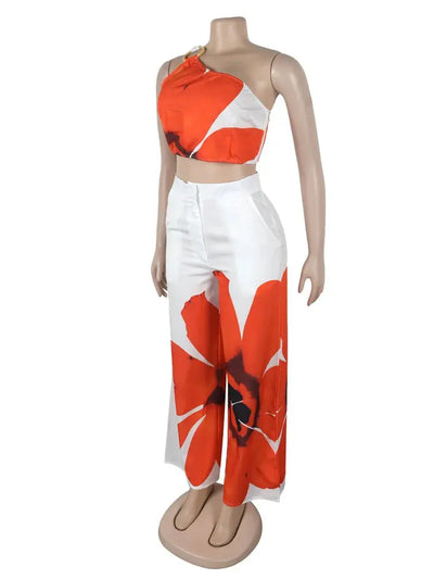 Hoochie Couture Floral Two-Piece Set – chic women’s co-ord with vibrant floral print, featuring a cropped top and matching high-waisted shorts or skirt, perfect for summer, brunch, or vacation wear