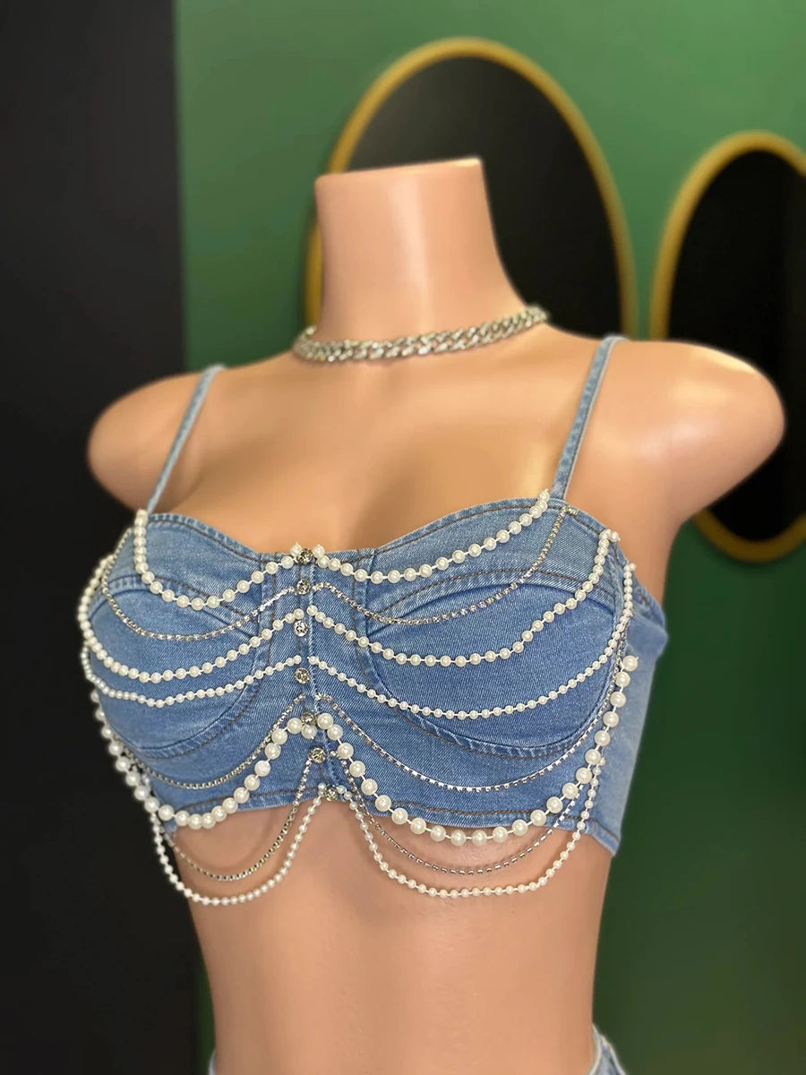 Hoochie Couture Denim Pearl Chain 2-Piece Set – women’s matching outfit with cropped jean top and pearl-detailed cargo shorts or pants, trendy Y2K streetwear look for summer or festival fashion.