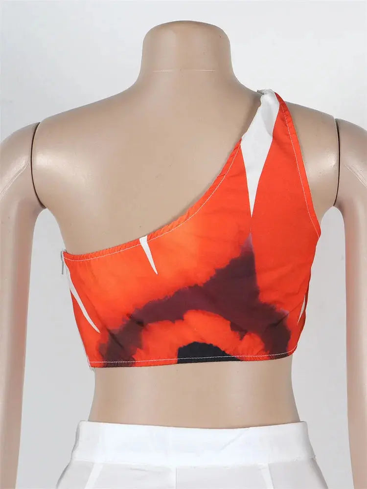 Hoochie Couture Floral Two-Piece Set – chic women’s co-ord with vibrant floral print, featuring a cropped top and matching high-waisted shorts or skirt, perfect for summer, brunch, or vacation wear
