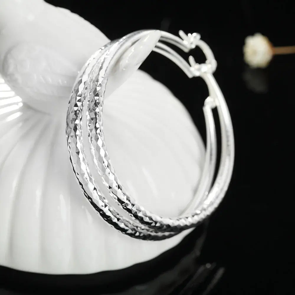 Hoochie Couture 925 Sterling Silver Hoop Earrings – Timeless Elegance with a Bold Twist Hoochie Couture Boutique