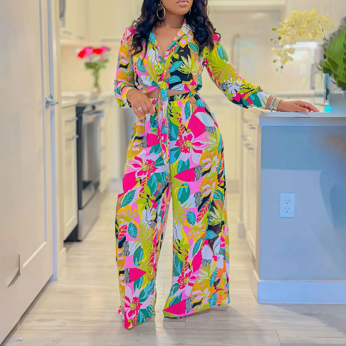 Hoochie Couture Printed Two-Piece Set – stylish women’s matching outfit with bold all-over print, featuring a crop top and high-waisted shorts or pants, perfect for summer streetwear, vacation, or festival fashion.