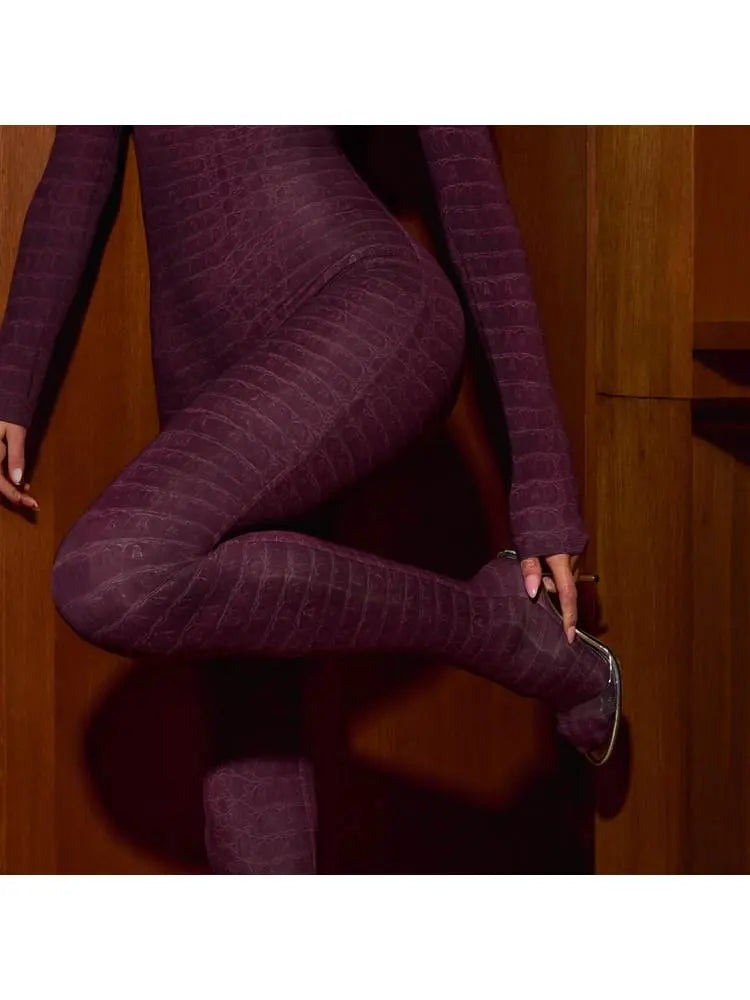 Hoochie Couture Snakeskin Printed Mock Neck Jumpsuit – Sleek, Bold & Bodycon Perfection