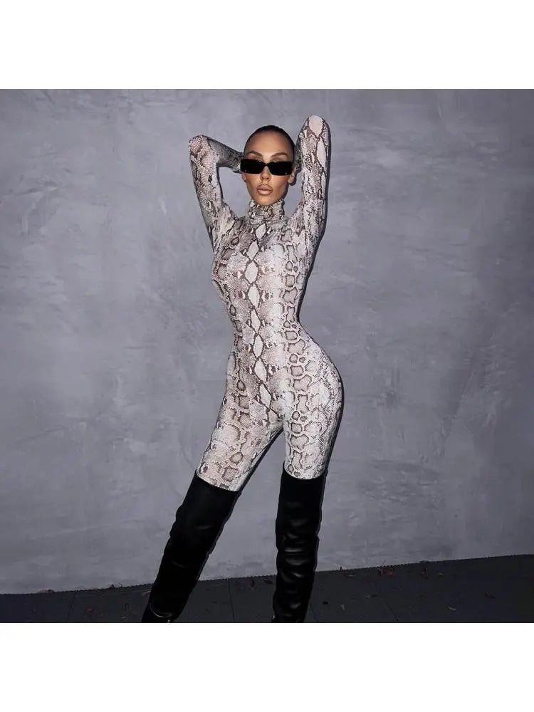 Hoochie Couture Snakeskin Printed Mock Neck Jumpsuit – Sleek, Bold & Bodycon Perfection
