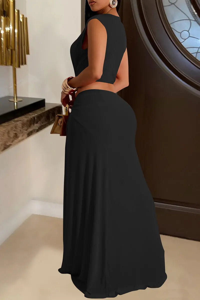 Hoochie Couture Hollow-Out High Slit Dress – daring women’s maxi dress featuring bold cut-out details, a thigh-high side slit, and a bodycon fit, perfect for night-out looks, clubwear, or statement evening fashion.
