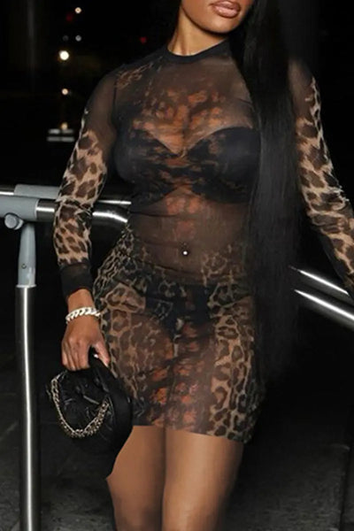 Hoochie Couture Leopard Mesh Wrap Dress – sheer and sultry women’s dress featuring a bold leopard print, wrap silhouette, and lightweight mesh fabric, perfect for night-out, beach cover-up, or resort wear
