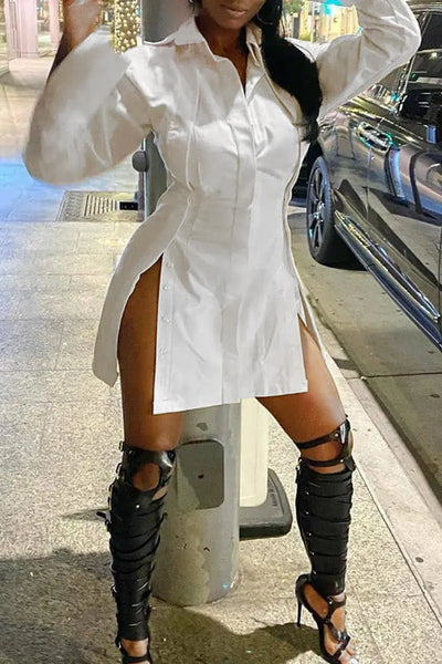 Hoochie Couture Buckle Slit Shirt Dress – edgy and structured women’s shirt dress featuring a front buckle detail, thigh-high slit, and tailored silhouette, perfect for street style, night-out looks, or fashion-forward daywear.