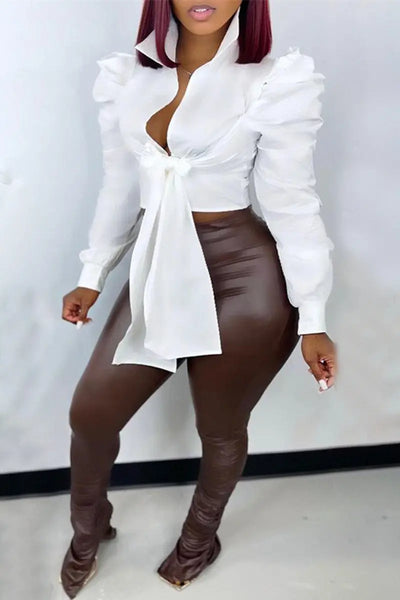 Hoochie Couture Bandage Wrap Top – sexy and structured women’s crop top featuring a bandage-style wrap design, deep V-neckline, and adjustable tie closure, perfect for night-out looks, clubwear, or bold street style outfits.