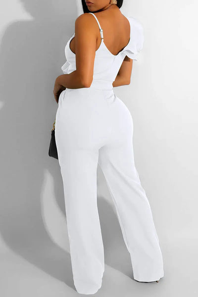 Hoochie Couture V-Neck Patchwork Jumpsuit – edgy and figure-flattering women’s one-piece featuring a deep V-neckline, bold colorblock patchwork design, and bodycon fit, perfect for street style, nightlife, or fashion-forward daywear.
